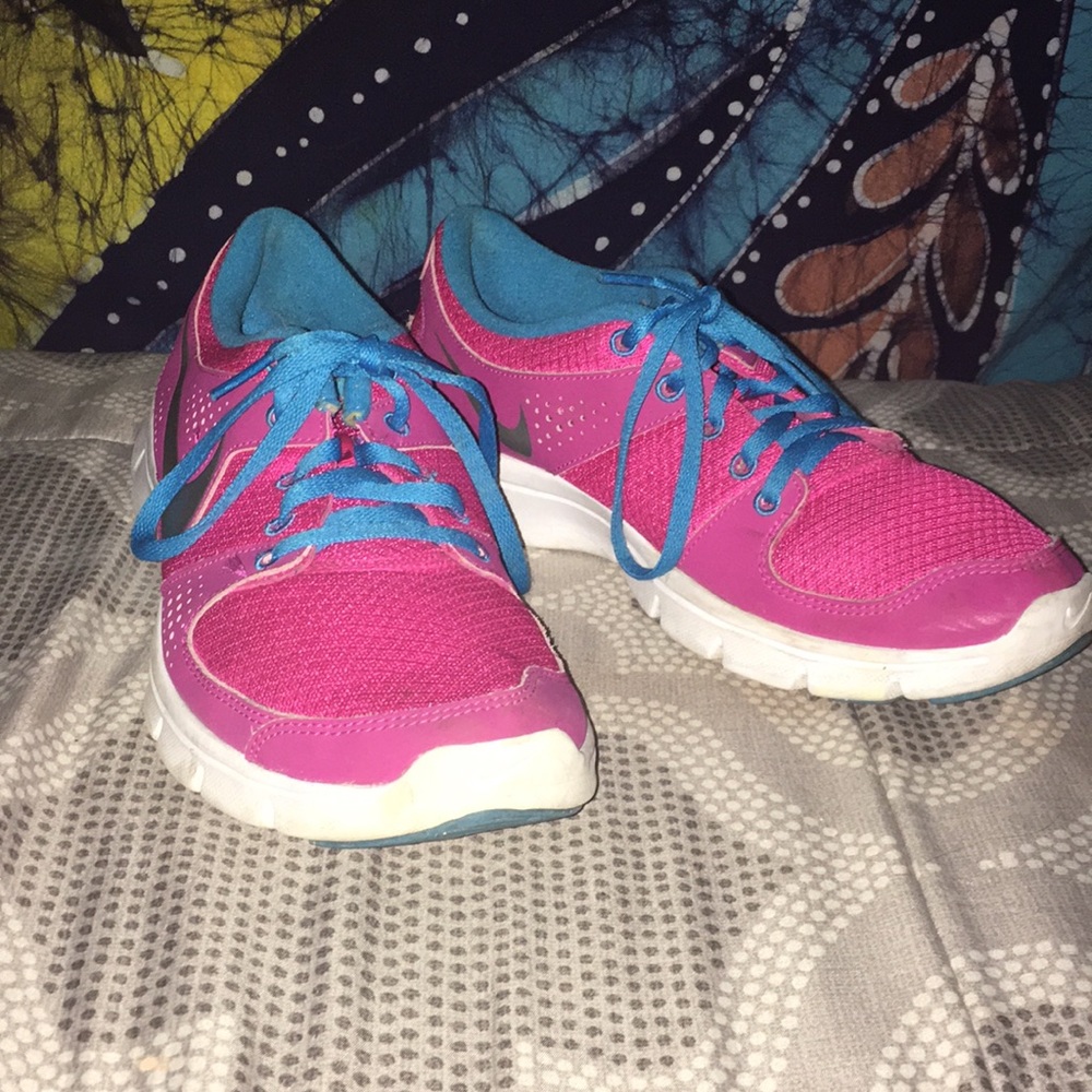 A pair of pink Nike sneakers